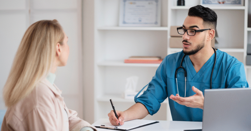 Doctor talking to patient about health literacy.