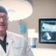 Neurosurgeon reviewing spinal imaging on a monitor, representing advanced spine procedures at UMC