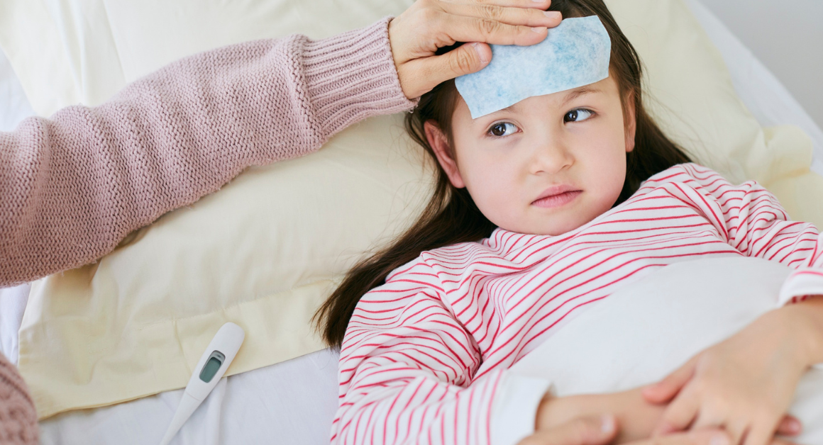 A child with a fever is being taken care of.