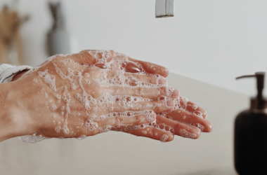 A person washes their hands with soap to help prevent the spread of germs and infections.
