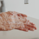 A person washes their hands with soap to help prevent the spread of germs and infections.